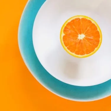 orange sliced in half in a plate